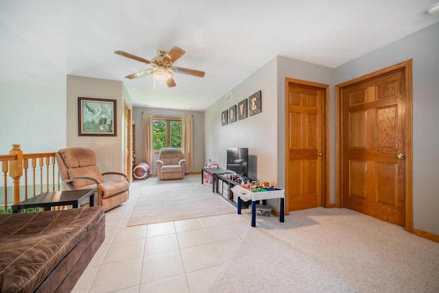 7459 Jensen Rd, Oshkosh, WI 54904 - living area with ceiling fan, light tile patterned floors, light carpet, and baseboards