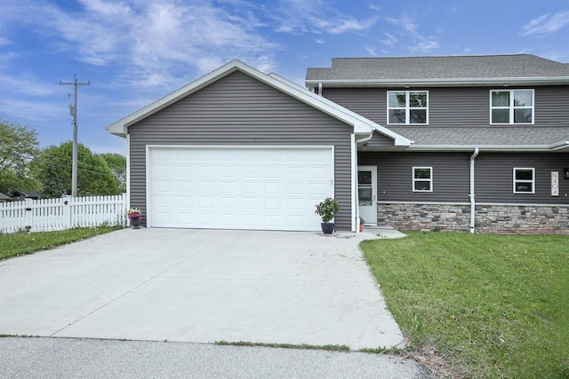 N406 Marion Ave, Appleton, WI 54915 - view of front facade featuring concrete driveway, a garage, roof with shingles, and stone siding