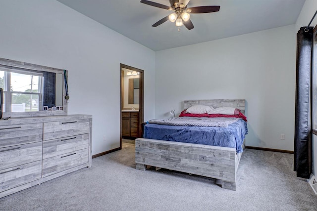 N406 Marion Ave, Appleton, WI 54915 - carpeted bedroom featuring ensuite bath, baseboards, ceiling fan, and a sink