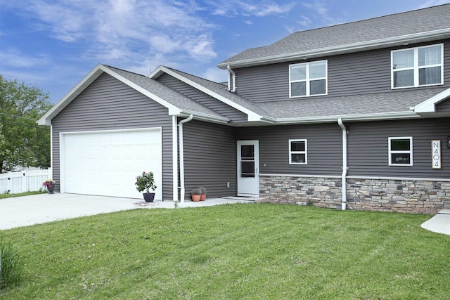 N406 Marion Ave, Appleton, WI 54915 - view of front of home featuring an attached garage, a shingled roof, and driveway