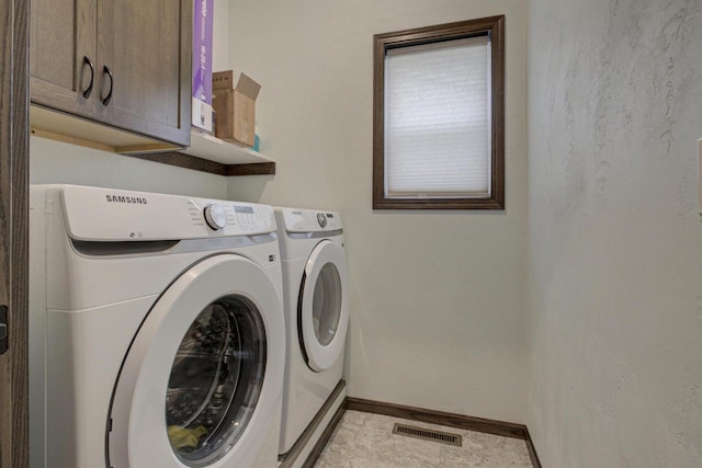 N406 Marion Ave, Appleton, WI 54915 - laundry area featuring washer and dryer, cabinet space, and baseboards