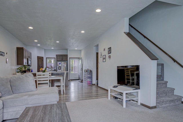N406 Marion Ave, Appleton, WI 54915 - living area with stairway, recessed lighting, wood finished floors, and baseboards