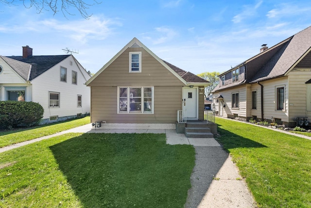 4131 N 41st St, Milwaukee, WI 53216 - bungalow featuring a front yard and a patio area