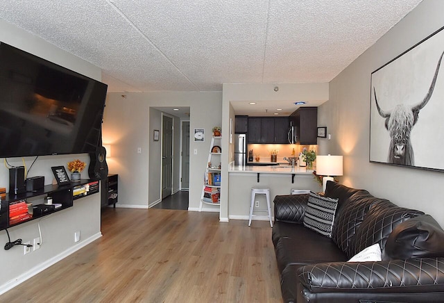 270 E Highland Ave Unit 644, Milwaukee, WI 53202 - living area with wood finished floors and a textured ceiling