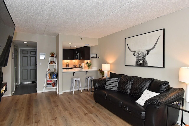 270 E Highland Ave Unit 644, Milwaukee, WI 53202 - living room featuring wood finished floors and a textured ceiling
