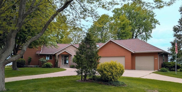 N8292 Deadwood Point Rd, Fond Du Lac, WI 54937 - view of front of property with an attached garage, concrete driveway, a front yard, and a shingled roof
