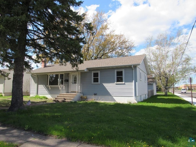 701 N 22nd St, Superior, WI 54880 - view of front facade with a chimney and a front lawn