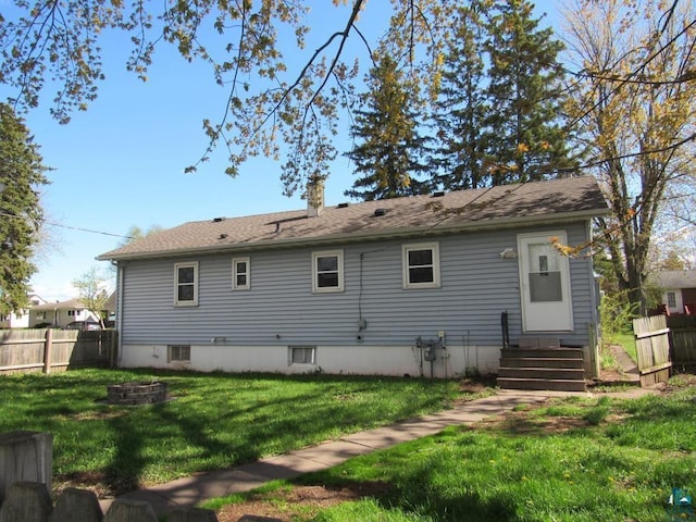 701 N 22nd St, Superior, WI 54880 - back of property with entry steps, a fire pit, and a chimney