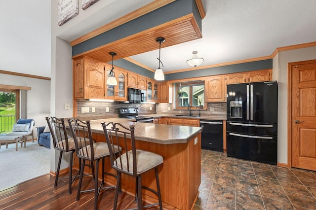 1420 Hidden Fields Dr, West Bend, WI 53095 - kitchen featuring black appliances, a sink, plenty of natural light, glass insert cabinets, and ornamental molding