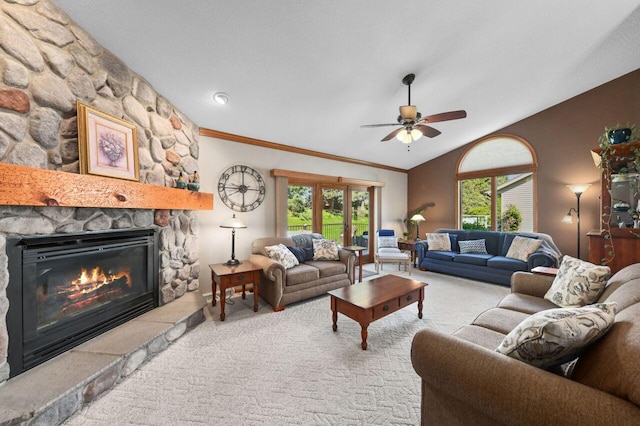 1420 Hidden Fields Dr, West Bend, WI 53095 - carpeted living area featuring a ceiling fan, a stone fireplace, lofted ceiling, and crown molding