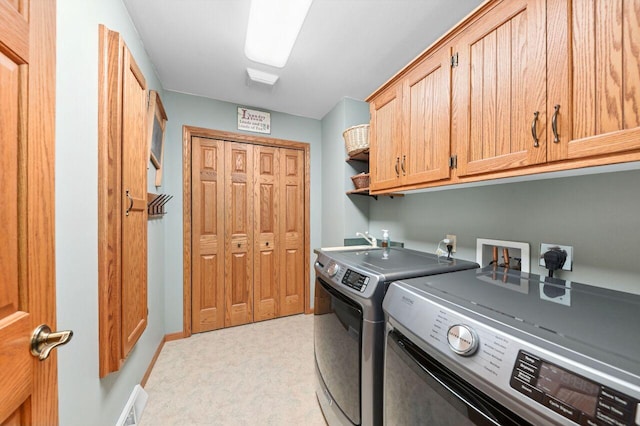 1420 Hidden Fields Dr, West Bend, WI 53095 - laundry area featuring cabinet space, independent washer and dryer, light colored carpet, and baseboards