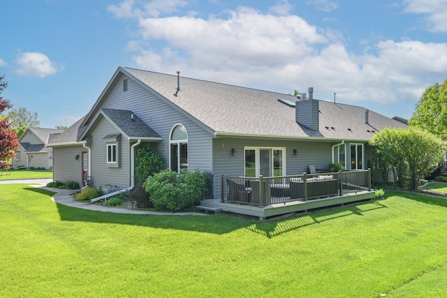 1420 Hidden Fields Dr, West Bend, WI 53095 - back of house featuring a wooden deck, a lawn, a chimney, and a shingled roof