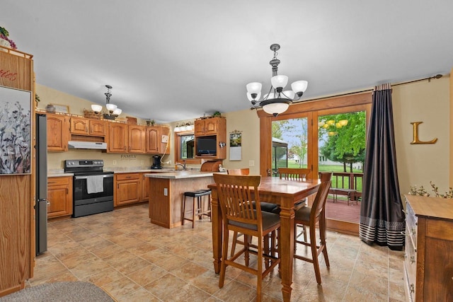 557 Center St, Berlin, WI 54923 - dining area featuring a chandelier and light stone finish floors