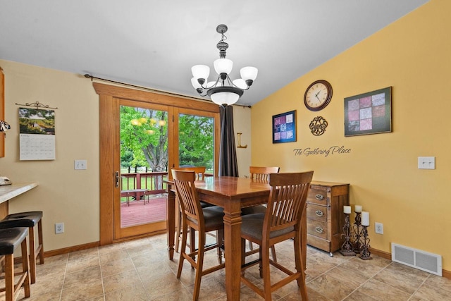 557 Center St, Berlin, WI 54923 - dining area featuring baseboards, a chandelier, and stone finish floors