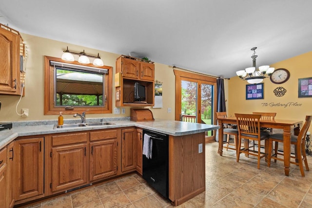 557 Center St, Berlin, WI 54923 - kitchen featuring dishwasher, a sink, a peninsula, a chandelier, and brown cabinets