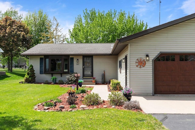 557 Center St, Berlin, WI 54923 - view of front of property featuring a garage, a front lawn, and roof with shingles