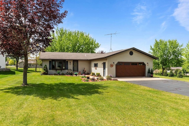 557 Center St, Berlin, WI 54923 - ranch-style house featuring an attached garage, asphalt driveway, and a front yard