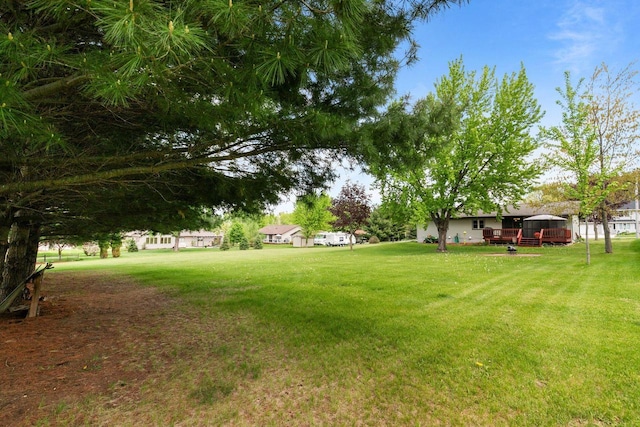 557 Center St, Berlin, WI 54923 - view of grassy yard with a deck
