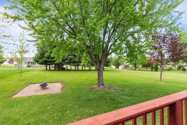 557 Center St, Berlin, WI 54923 - view of grassy yard with a fire pit and a patio