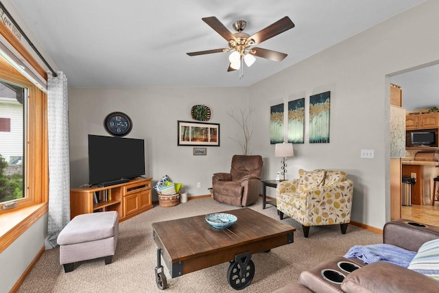 557 Center St, Berlin, WI 54923 - carpeted living room featuring a ceiling fan, baseboards, and vaulted ceiling