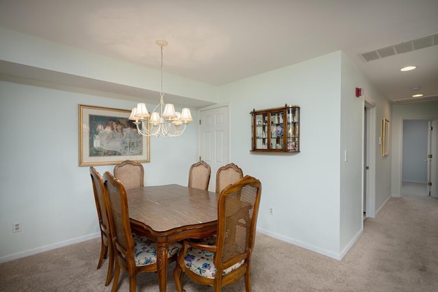 8707 Westlake Dr, Greendale, WI 53129 - dining space featuring a chandelier, baseboards, light colored carpet, and recessed lighting