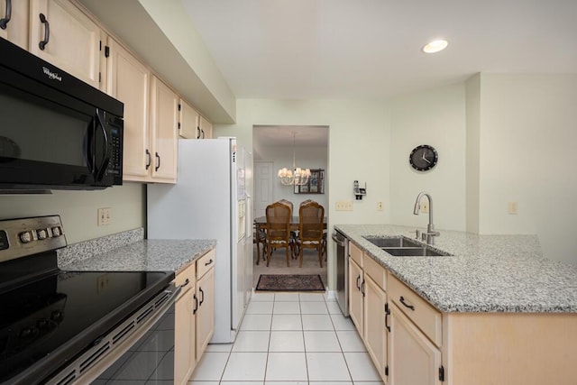 8707 Westlake Dr, Greendale, WI 53129 - kitchen with stainless steel appliances, a sink, a chandelier, a peninsula, and light tile patterned floors