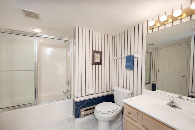 8707 Westlake Dr, Greendale, WI 53129 - full bathroom with tile patterned flooring, vanity, toilet, bath / shower combo with glass door, and a baseboard heating unit