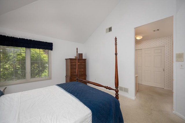 8707 Westlake Dr, Greendale, WI 53129 - bedroom with light carpet, vaulted ceiling, and baseboards