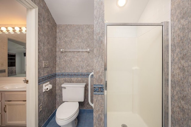 8707 Westlake Dr, Greendale, WI 53129 - bathroom featuring a shower stall, vanity, tile patterned floors, and toilet