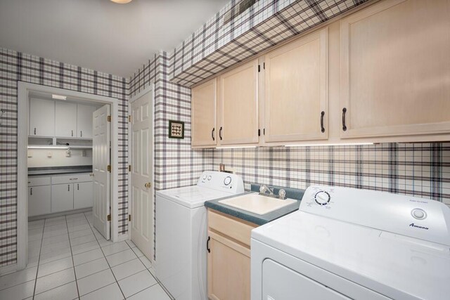 8707 Westlake Dr, Greendale, WI 53129 - laundry room with cabinet space, wallpapered walls, light tile patterned flooring, and washing machine and dryer