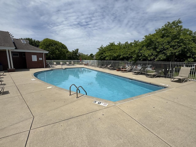8707 Westlake Dr, Greendale, WI 53129 - community pool featuring a patio and view of scattered trees