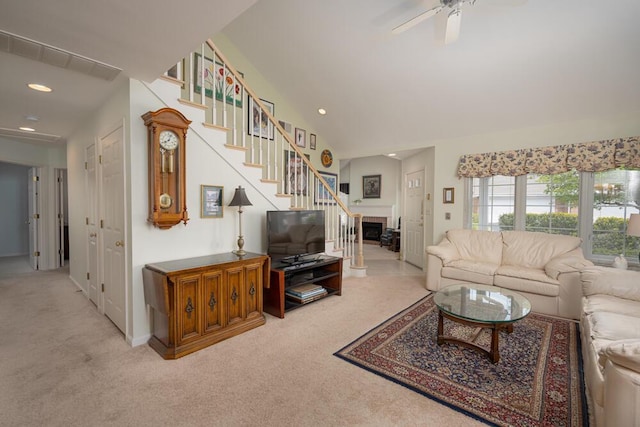 8707 Westlake Dr, Greendale, WI 53129 - carpeted living room featuring a ceiling fan, a fireplace, stairway, and recessed lighting