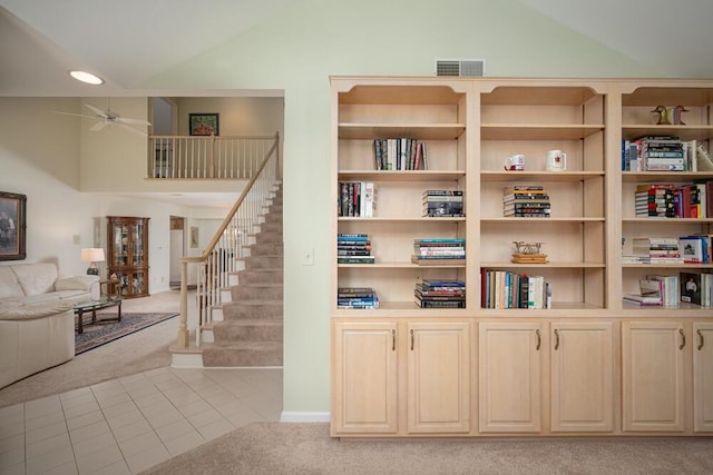 8707 Westlake Dr, Greendale, WI 53129 - staircase featuring carpet flooring, vaulted ceiling, a ceiling fan, tile patterned floors, and recessed lighting