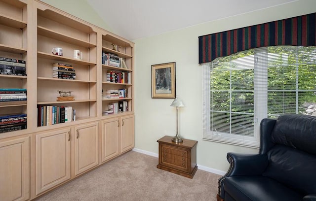 8707 Westlake Dr, Greendale, WI 53129 - sitting room featuring light carpet, baseboards, and vaulted ceiling