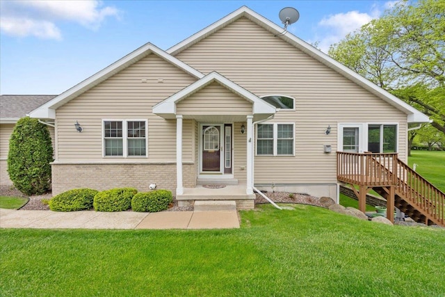 119 Summit Ct, Columbus, WI 53925 - bungalow-style home with a front yard and brick siding