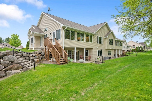119 Summit Ct, Columbus, WI 53925 - rear view of house with a patio area, stairs, a yard, roof with shingles, and central air condition unit