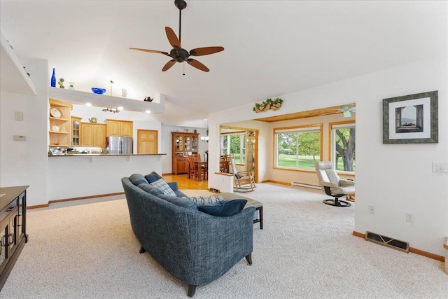119 Summit Ct, Columbus, WI 53925 - living area featuring light colored carpet, baseboards, a ceiling fan, and vaulted ceiling