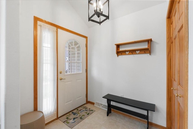 119 Summit Ct, Columbus, WI 53925 - foyer with vaulted ceiling, a chandelier, plenty of natural light, baseboards, and light tile patterned floors