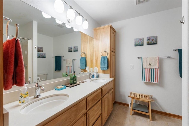 119 Summit Ct, Columbus, WI 53925 - full bathroom featuring tile patterned floors, double vanity, toilet, baseboards, and a shower with shower curtain