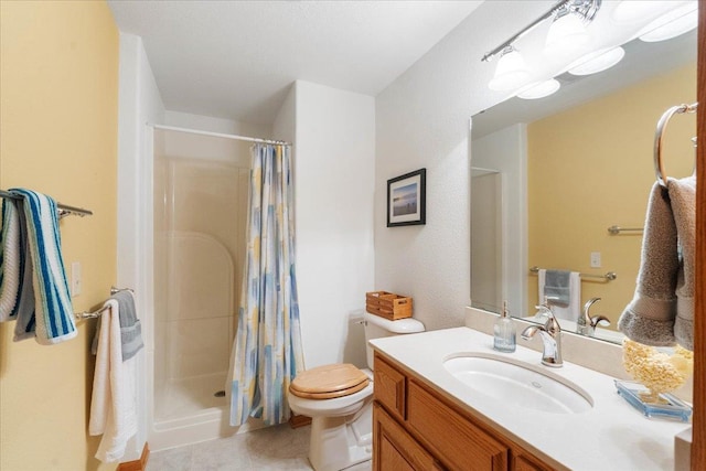 119 Summit Ct, Columbus, WI 53925 - full bathroom with vanity, a shower with shower curtain, toilet, and tile patterned floors