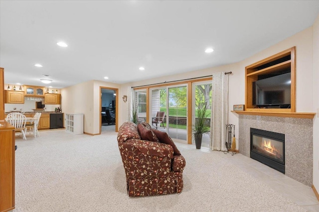 119 Summit Ct, Columbus, WI 53925 - living room featuring recessed lighting, a tiled fireplace, light carpet, and baseboards