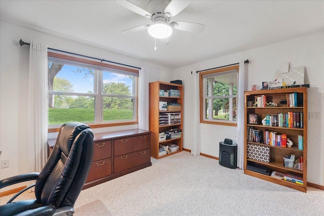 119 Summit Ct, Columbus, WI 53925 - home office featuring a ceiling fan, light colored carpet, and baseboards