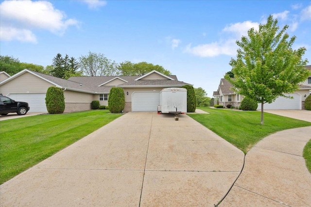 119 Summit Ct, Columbus, WI 53925 - view of front of house featuring a front lawn, concrete driveway, brick siding, an attached garage, and roof with shingles