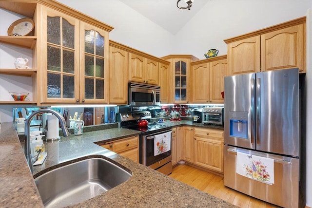 119 Summit Ct, Columbus, WI 53925 - kitchen with appliances with stainless steel finishes, a sink, light wood finished floors, glass insert cabinets, and open shelves