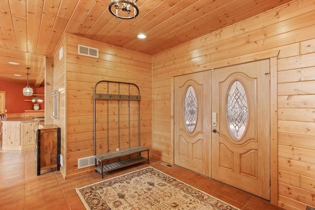 W5271 Southview Dr, Necedah, WI 54646 - tiled foyer entrance featuring wood ceiling, recessed lighting, and wood walls