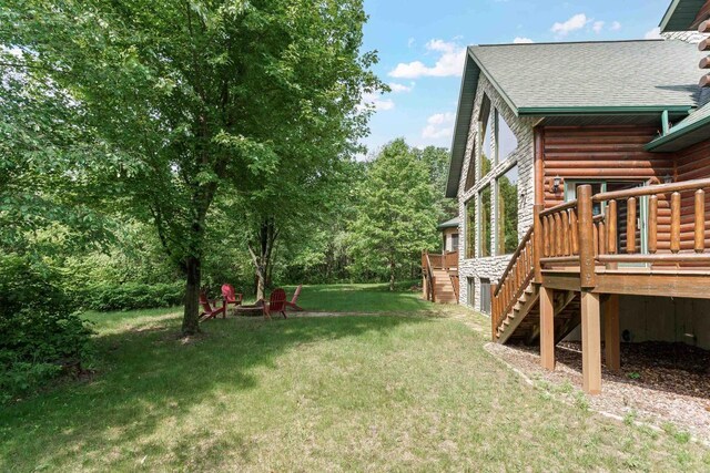 W5271 Southview Dr, Necedah, WI 54646 - view of green lawn with stairway and a deck