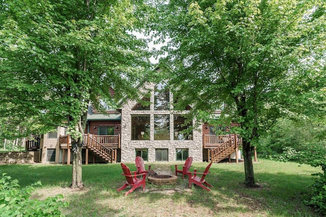 W5271 Southview Dr, Necedah, WI 54646 - back of house with stairs, a deck, and stone siding