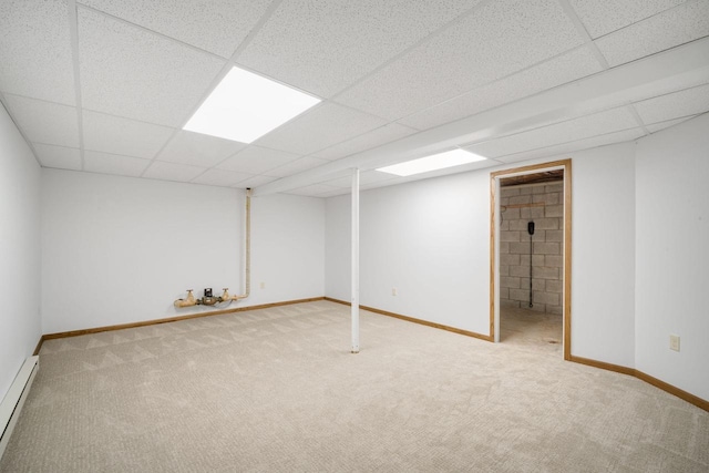 7233 W Wabash Ave, Milwaukee, WI 53223 - finished below grade area with a baseboard heating unit, a drop ceiling, carpet flooring, and baseboards