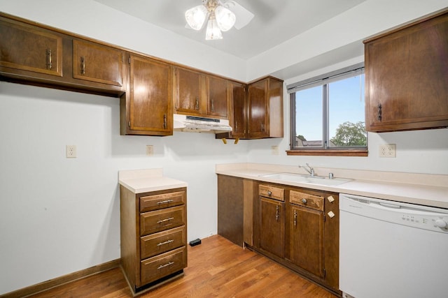 7233 W Wabash Ave, Milwaukee, WI 53223 - kitchen with white dishwasher, under cabinet range hood, light wood-type flooring, a ceiling fan, and a sink