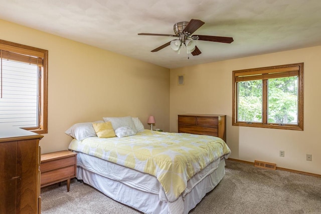 1074 Pendleton Rd, Neenah, WI 54956 - carpeted bedroom with baseboards and ceiling fan